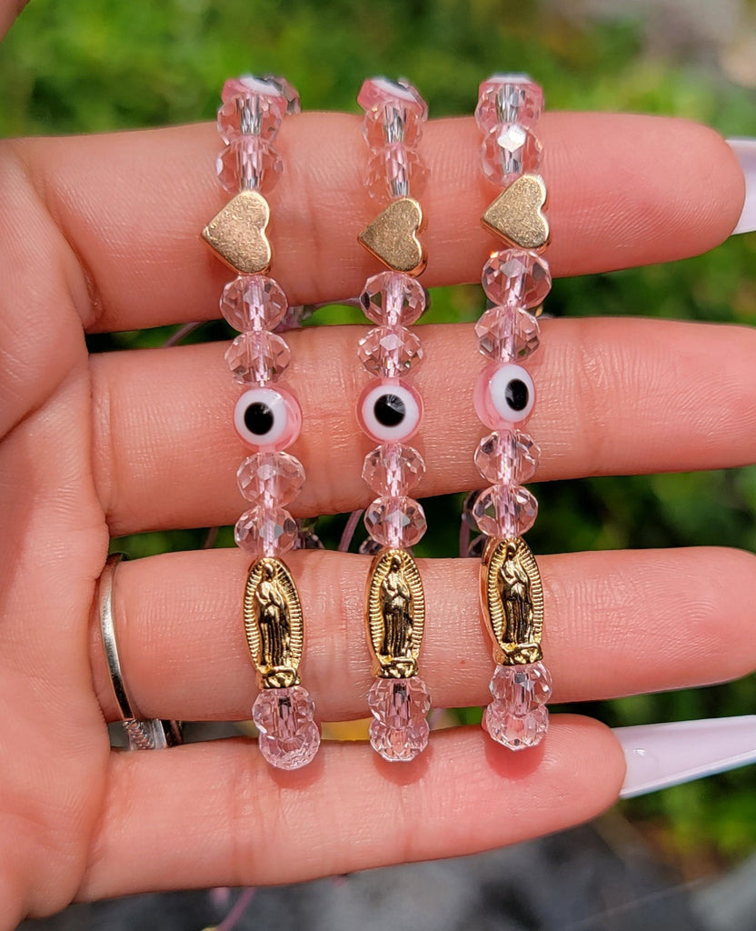 Pink bead bracelet meaning on sale